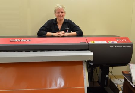 Tracey Shanks partner at Mercury Signs and Designs and the high speed Roland beast 